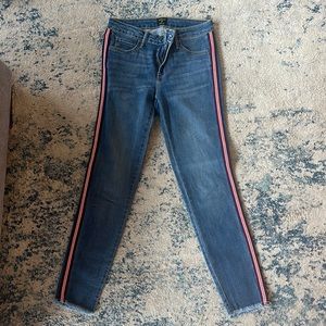 Blue jeans with red and navy stripe down the side